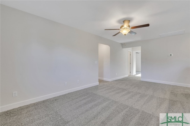 spare room featuring ceiling fan and light colored carpet