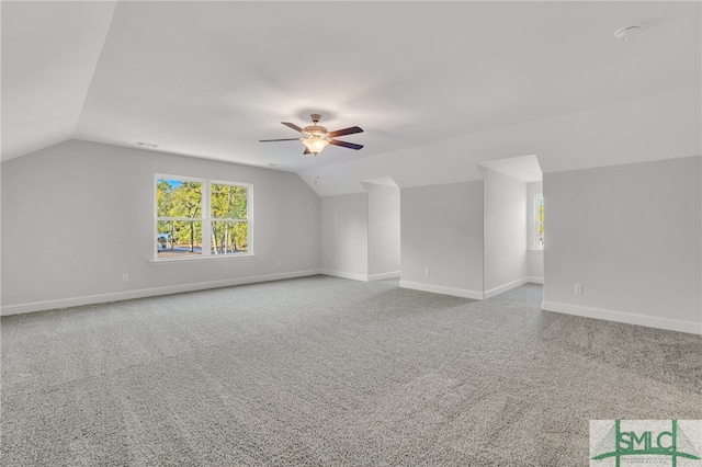 bonus room with carpet flooring, ceiling fan, and vaulted ceiling