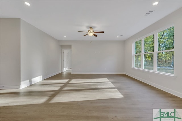 spare room with light hardwood / wood-style flooring and ceiling fan