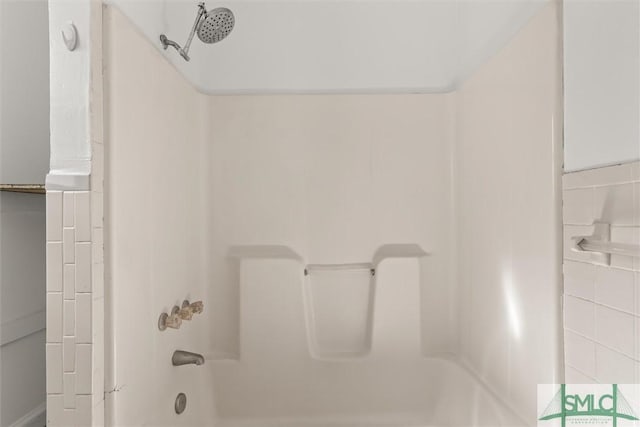 bathroom with bathing tub / shower combination