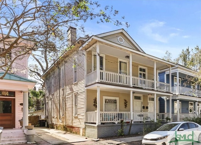 view of front of house featuring a balcony