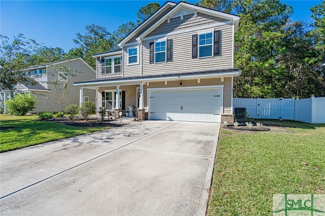 view of front of home featuring a front lawn, covered porch, and a garage