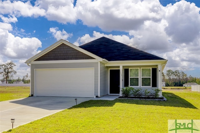 view of front of home featuring a garage and a front yard