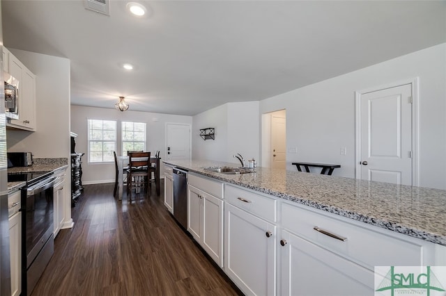 kitchen featuring dark hardwood / wood-style flooring, light stone counters, stainless steel appliances, sink, and white cabinetry