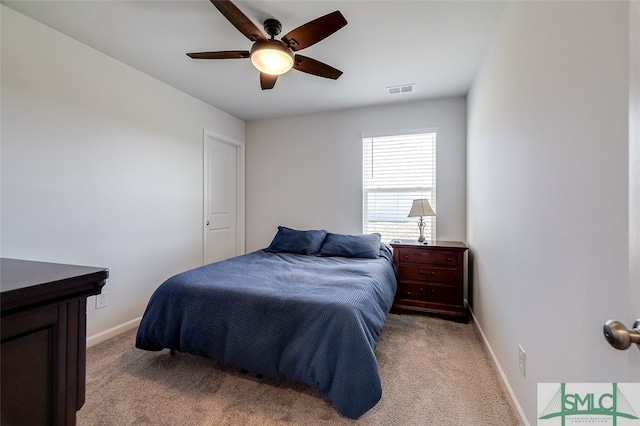 carpeted bedroom with ceiling fan