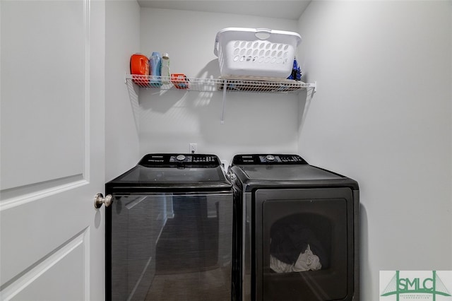 washroom with washer and clothes dryer