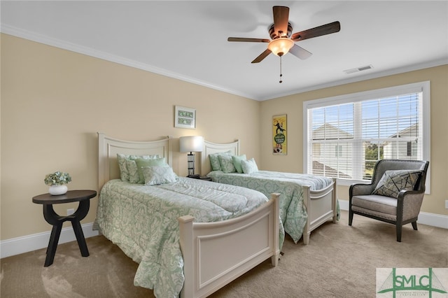 bedroom featuring crown molding, light carpet, and ceiling fan