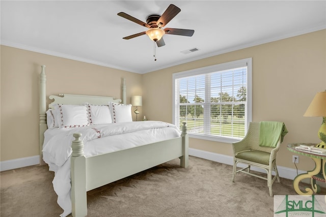 bedroom with ceiling fan, light colored carpet, and ornamental molding