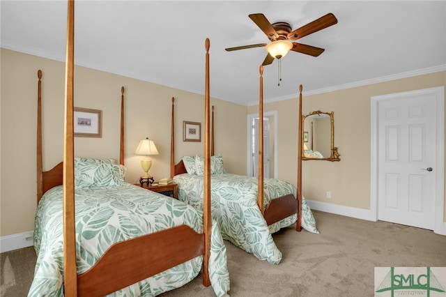 carpeted bedroom with ornamental molding and ceiling fan