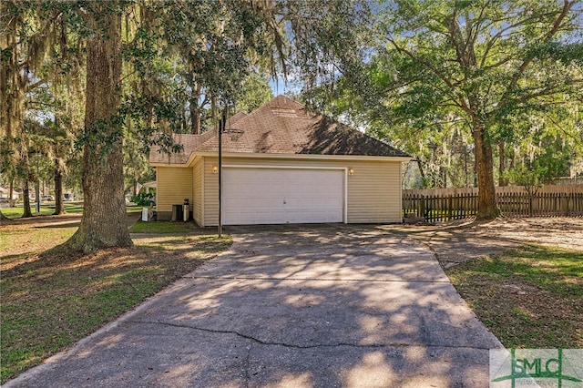 view of side of property featuring a garage