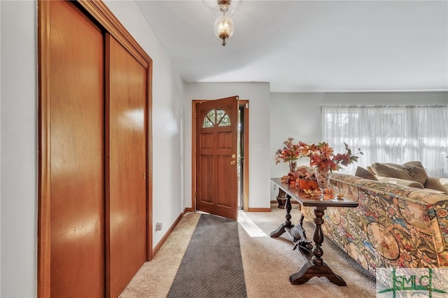 view of carpeted entrance foyer