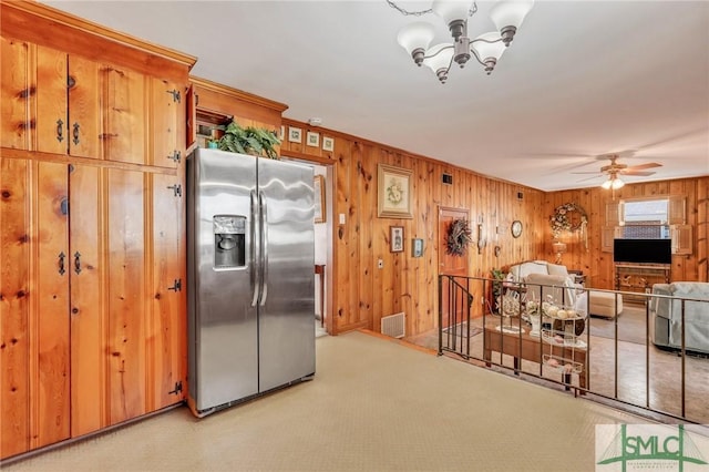 1462 Marlborough Way, Savannah, GA 31406 - kitchen featuring stainless steel fridge, a chandelier, wooden walls, ceiling fan, and ornamental molding