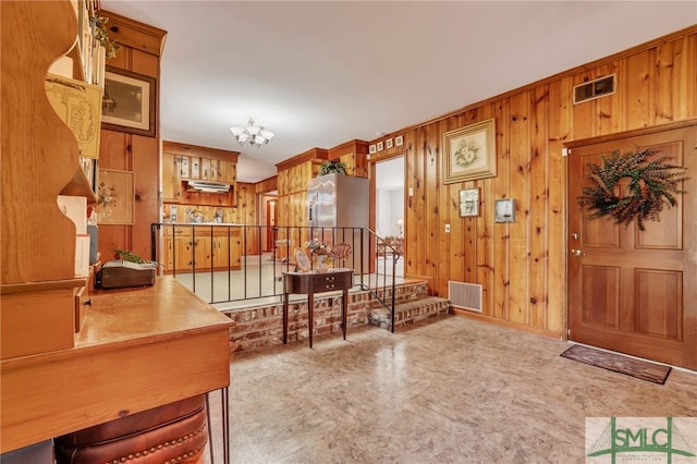 entrance foyer with wood walls