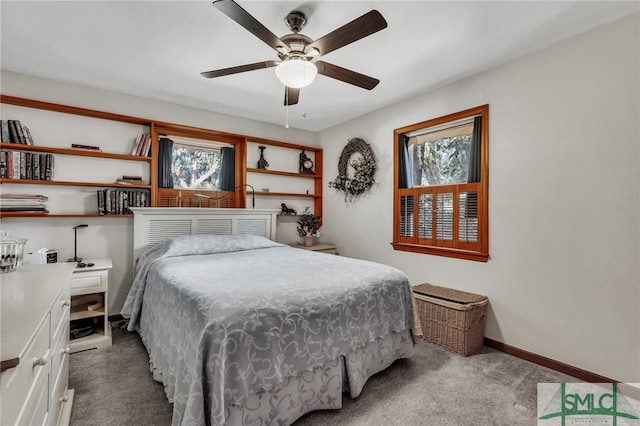 bedroom featuring ceiling fan and light colored carpet