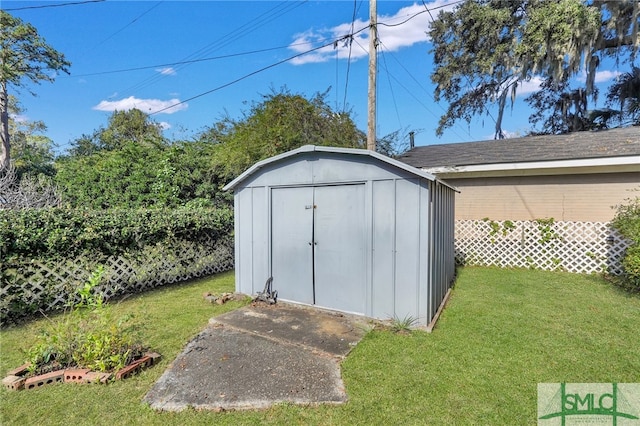 view of outdoor structure with a yard