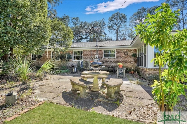 1462 Marlborough Way, Savannah, GA 31406 - back of house with brick siding and a patio area