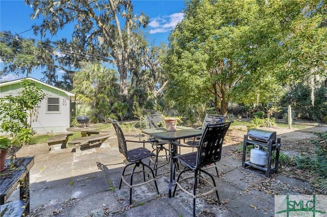 1462 Marlborough Way, Savannah, GA 31406 - view of patio featuring outdoor dining area, an outbuilding, and grilling area