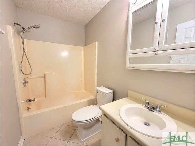 full bath featuring a textured ceiling, tile patterned flooring, toilet, vanity, and washtub / shower combination