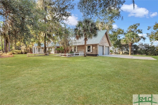 view of front facade with a front yard and a garage