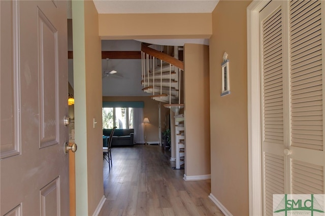 corridor with wood-type flooring