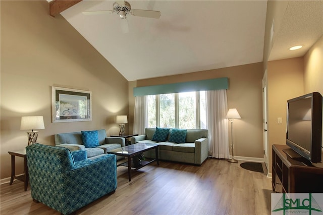 living room featuring ceiling fan, hardwood / wood-style floors, and high vaulted ceiling