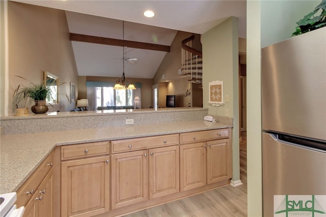 kitchen with an inviting chandelier, lofted ceiling with beams, light hardwood / wood-style flooring, stainless steel fridge, and light brown cabinetry