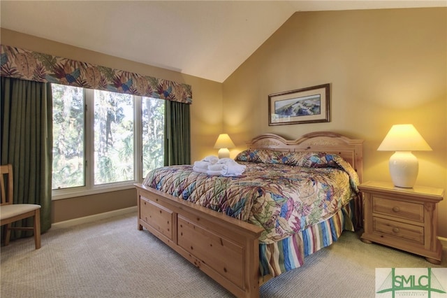 carpeted bedroom featuring vaulted ceiling