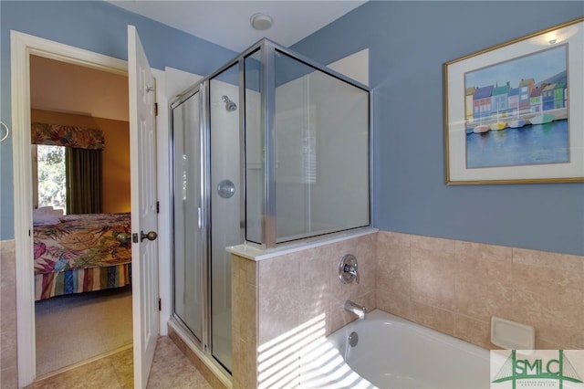 bathroom with separate shower and tub and tile patterned flooring