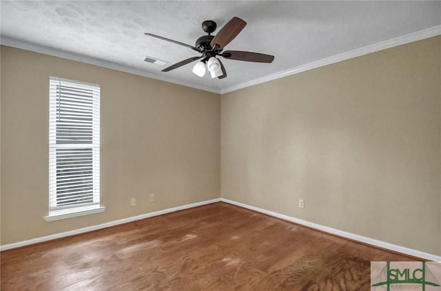 unfurnished room with ornamental molding and ceiling fan