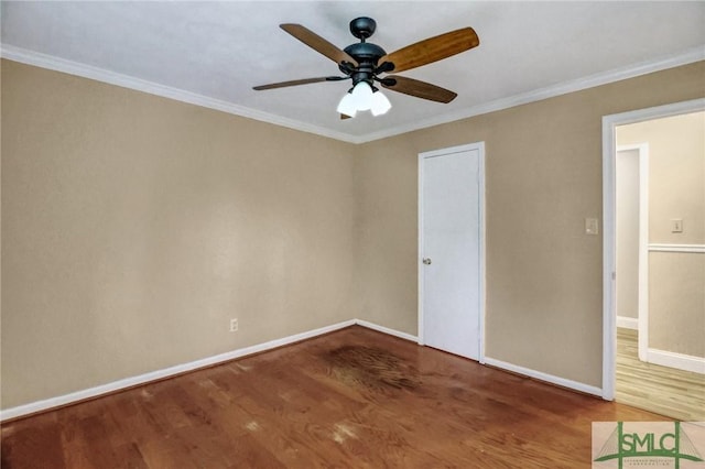 empty room featuring crown molding, wood-type flooring, and ceiling fan