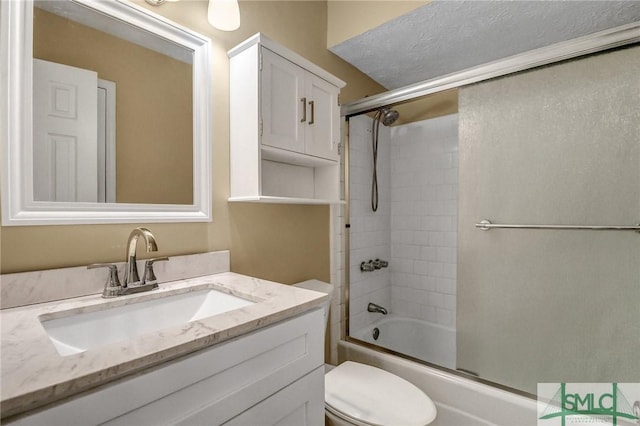 full bathroom featuring enclosed tub / shower combo, vanity, and toilet