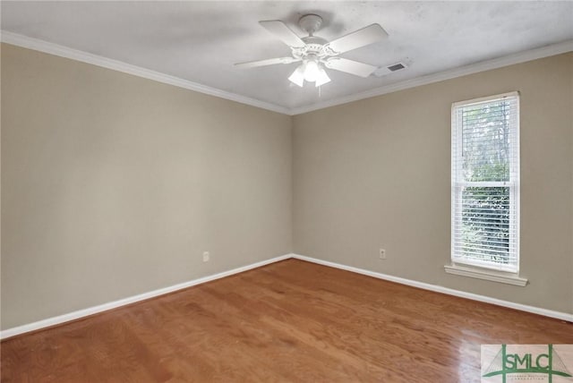 empty room with crown molding and ceiling fan