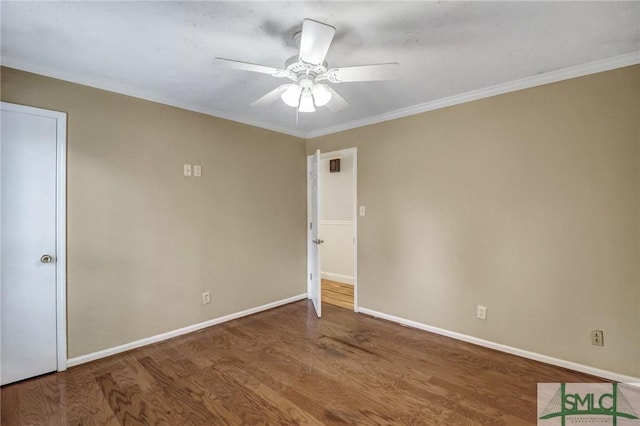 unfurnished room with ornamental molding, hardwood / wood-style floors, and ceiling fan