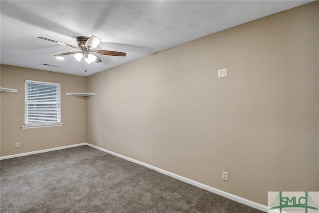 spare room with ceiling fan and carpet flooring