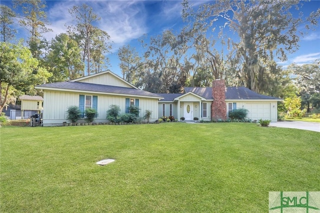 ranch-style home featuring a garage and a front yard