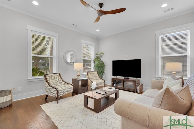 living room featuring dark hardwood / wood-style floors and ceiling fan