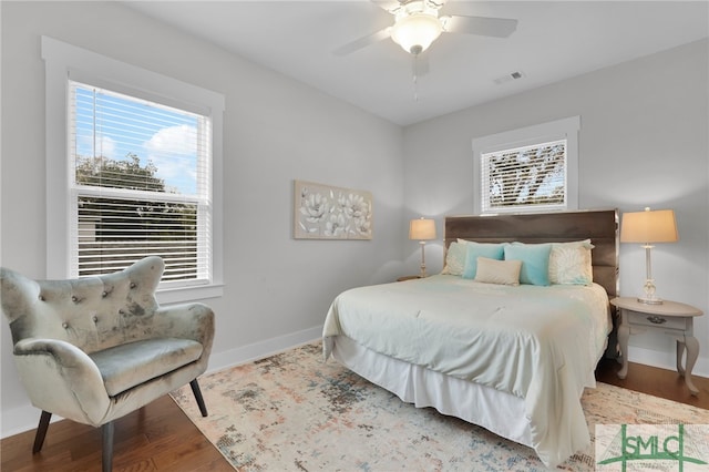 bedroom with ceiling fan and hardwood / wood-style floors