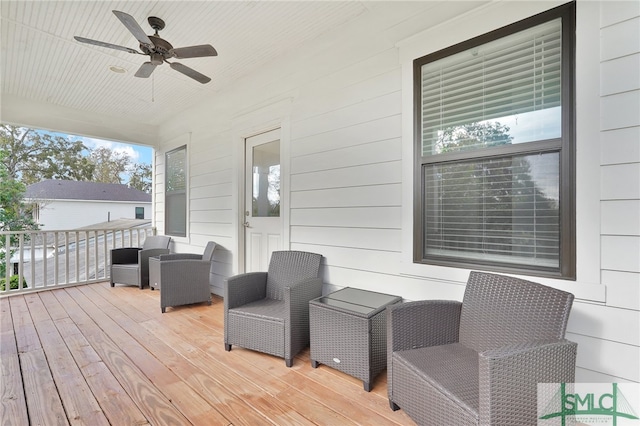 wooden deck with ceiling fan