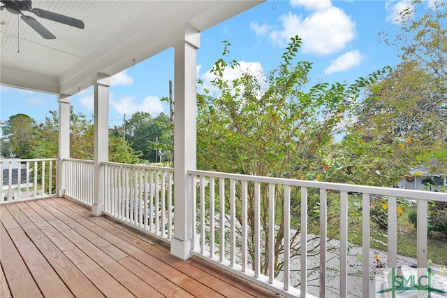 wooden terrace featuring ceiling fan