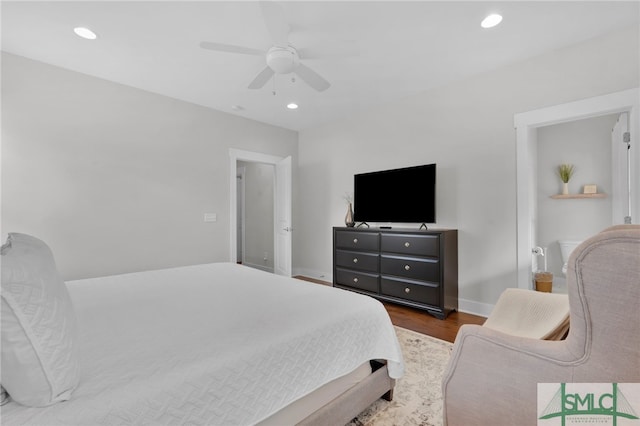 bedroom with ceiling fan and dark wood-type flooring