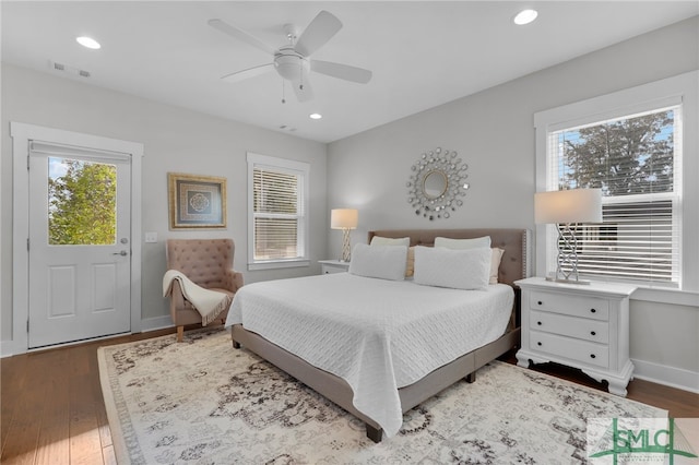 bedroom featuring ceiling fan and dark wood-type flooring