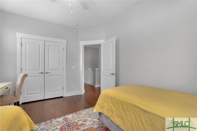 bedroom featuring dark hardwood / wood-style flooring, a closet, and ceiling fan