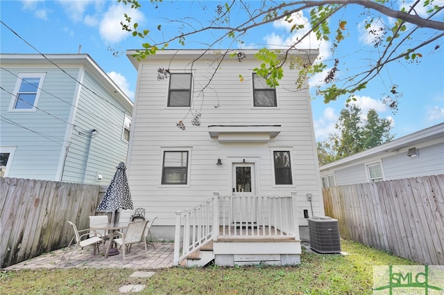 back of property featuring a patio area and central air condition unit