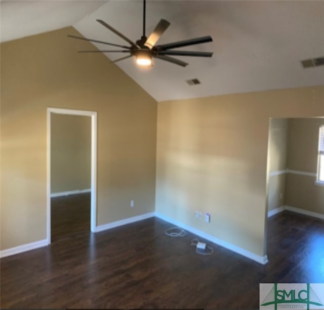 spare room featuring dark hardwood / wood-style floors, ceiling fan, and lofted ceiling