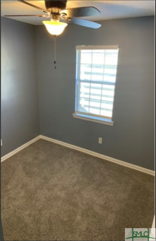 carpeted empty room with ceiling fan