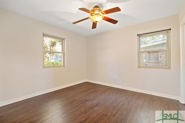 empty room featuring dark hardwood / wood-style floors and ceiling fan