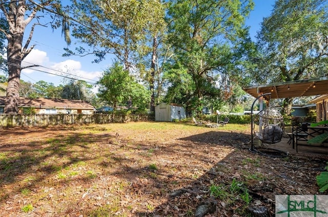 view of yard featuring a storage unit