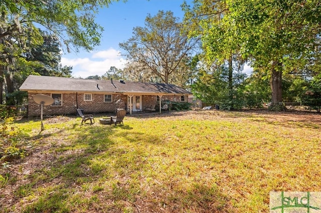 view of yard with a fire pit