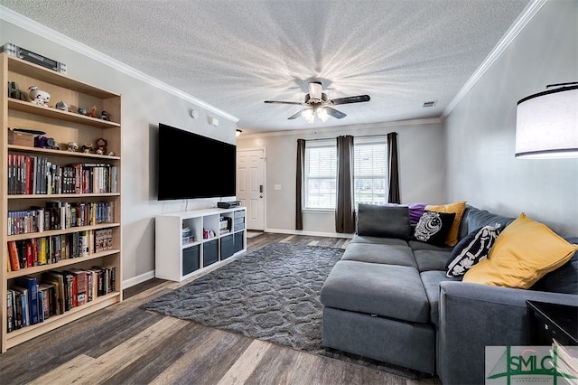 living room featuring a textured ceiling, dark hardwood / wood-style flooring, ceiling fan, and ornamental molding