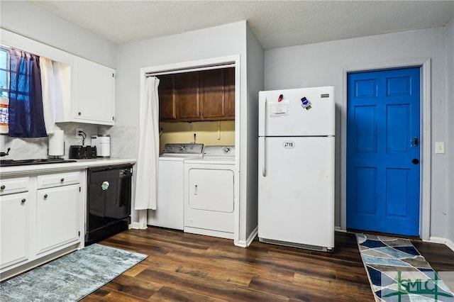 kitchen featuring black dishwasher, dark hardwood / wood-style floors, white fridge, white cabinets, and washer and dryer